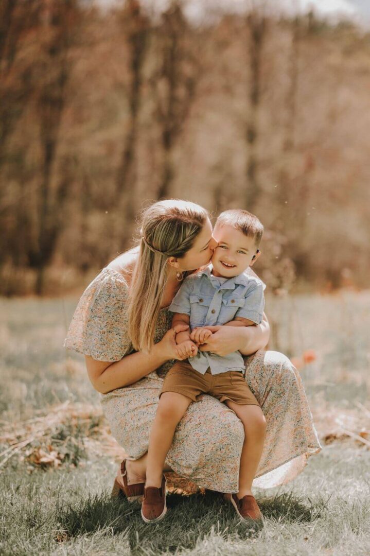 A woman holding a child in her arms.