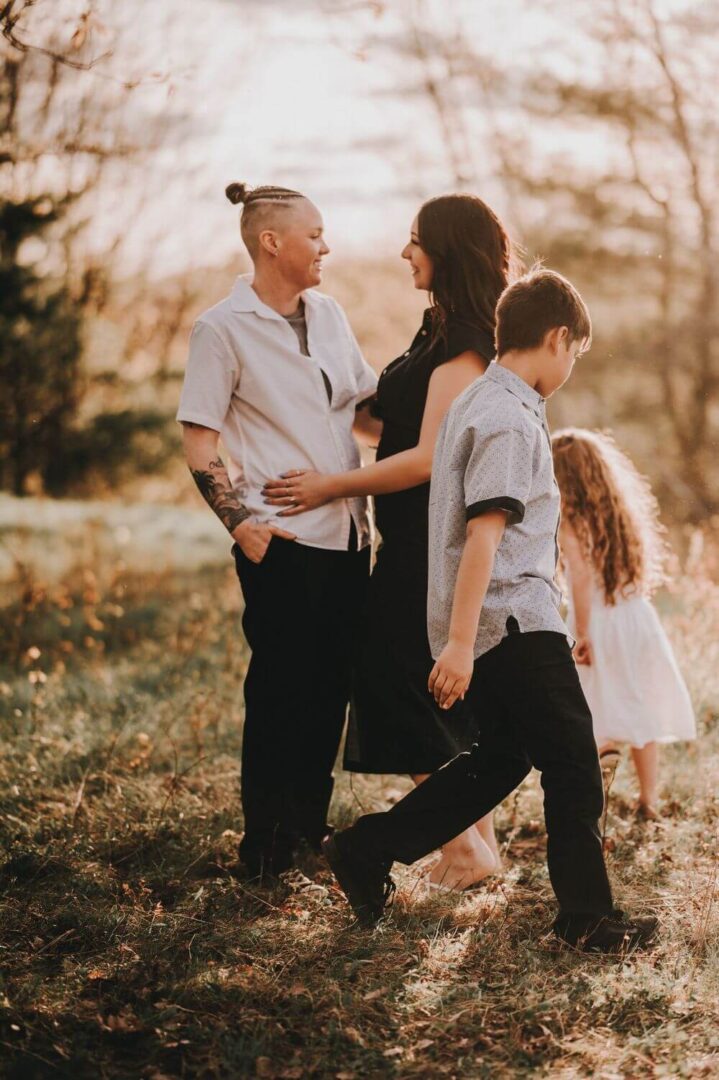 A family walking in the woods with one child